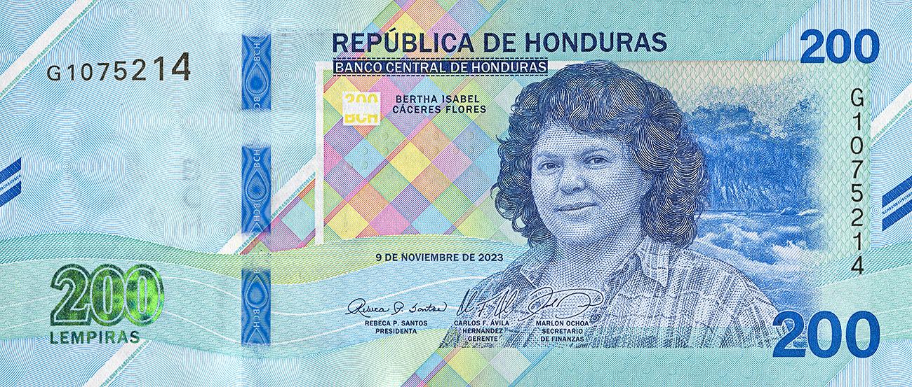 Bank note, blue, portrait of a woman with shoulder-length wavy hair facing forward and wearing a checkered shirt.