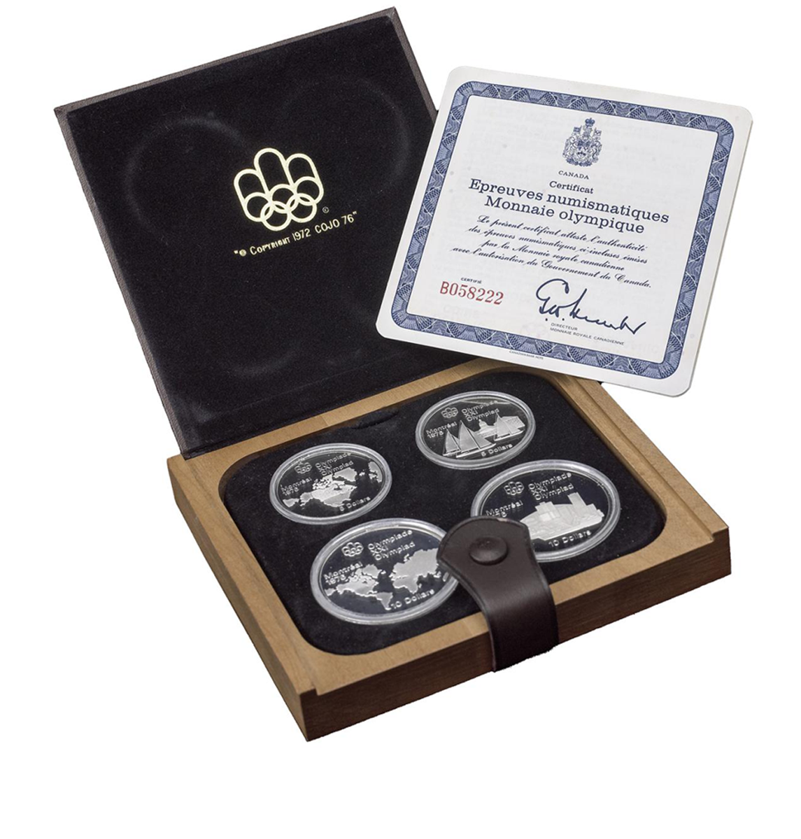 Wood and leather case holding four silver coins of two sizes alongside a certificate.
