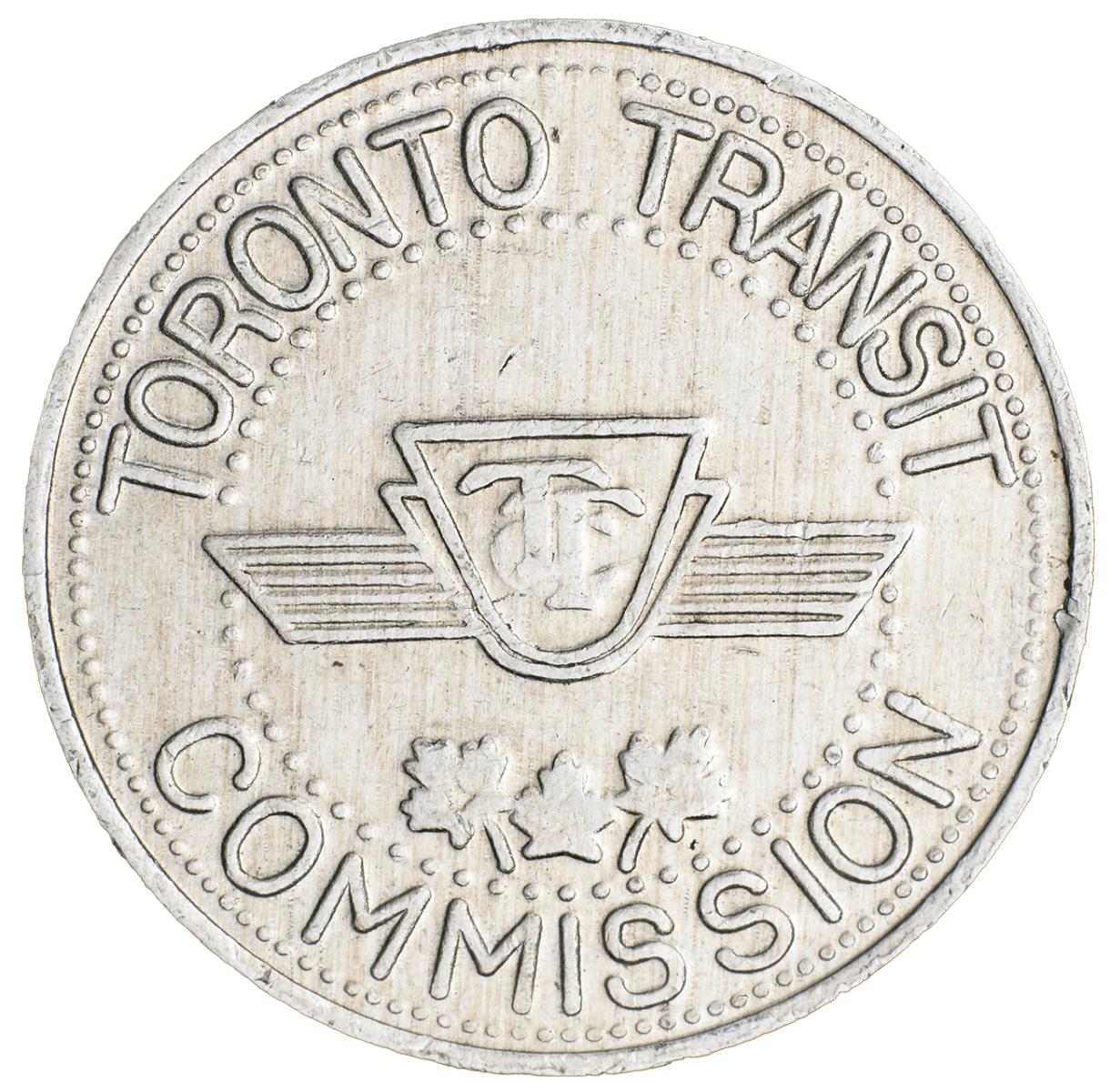 Toronto transit token Token, round, silver colour, logo with the letters TTC layered over each other.