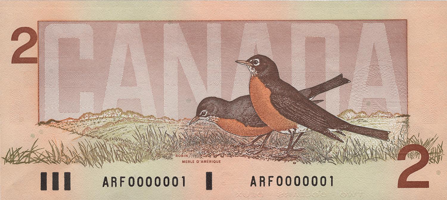 The back of the 1986 2-dollar bank note featuring two robins.